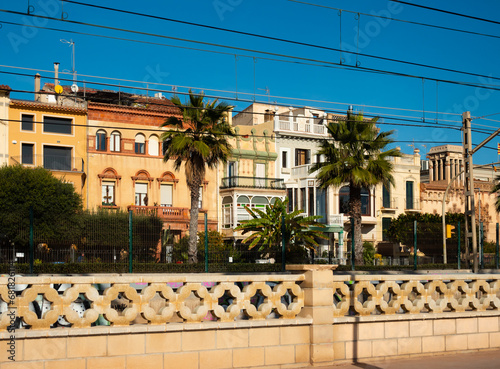 Picturesque street view of modern Vilassar de Mar on Mediterranean coast on sunny day, Spain.. photo