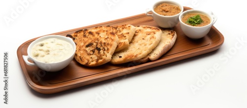In a white background isolated on a photo, a restaurant in Country serves an authentic Countryn breakfast for Diwali, consisting of healthy wheat bread and flat Asian bread, paired with milk, as the photo