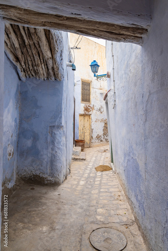 Blue walls on a narrow alley. © Emily_M_Wilson