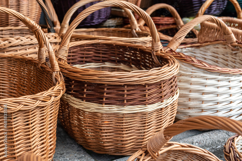 Many Wicker Baskets on Handicraft Market, New Wickerwork, Hand Made Basket, Bamboo Containers Many Wicker Baskets on Handicraft Market, New Wickerwork, Hand Made Basket, Bamboo Containers