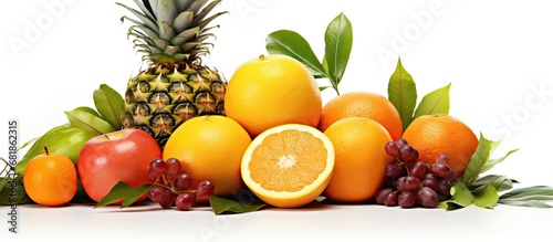 In a beautiful and natural setting  a set of healthy and organic fruits is presented on a white background  featuring a vibrant orange tropical fruit  surrounded by green leaves  evoking a sense of