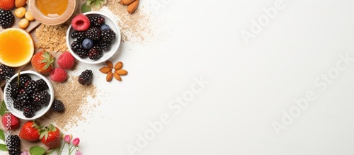 From a top view, a breakfast rich in organic, natural and healthy foods is showcased, including black honey, milk, cereal, and a protein-packed meal. This display represents a healthy lifestyle photo