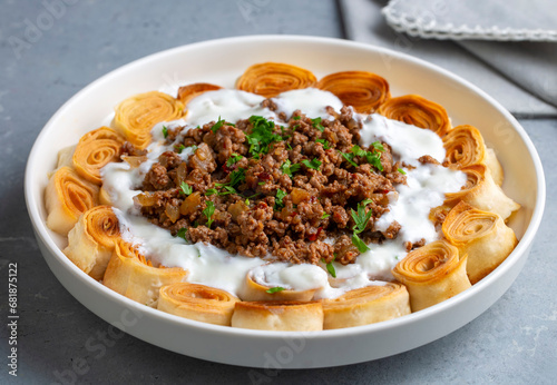 Turkish Manti with Yogurt, Minced Meat and Fried Butter Sauce From Artvin called Silor - Siron - Ziron Rolled Raw Dough and Fried Phyllo -Manlama with Dill