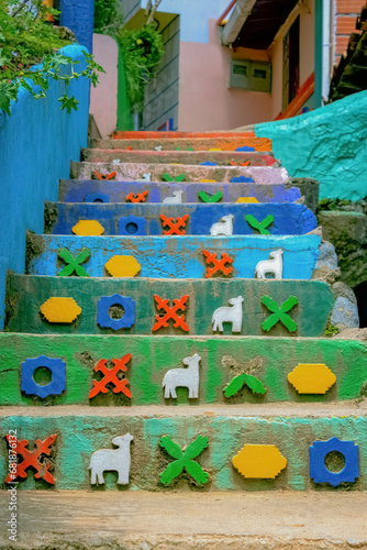 Stairs with figures in a neighborhood in Latin America.