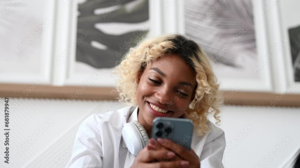 Smiling girl using smartphone for social media,communication,watching videos ,online shopping,food delivery etc Smiling girl using smartphone for social media,communication,watching videos ,online shopping,food delivery etc