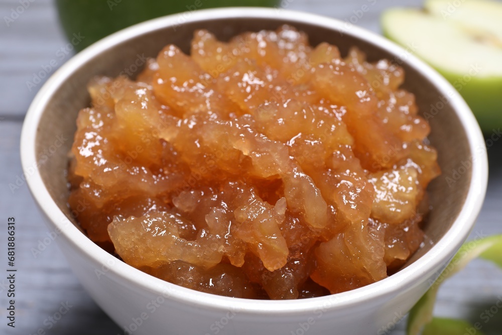 Delicious apple jam in bowl on table, closeup Delicious apple jam in bowl on table, closeup