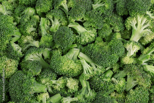 Fresh raw broccoli as background, top view