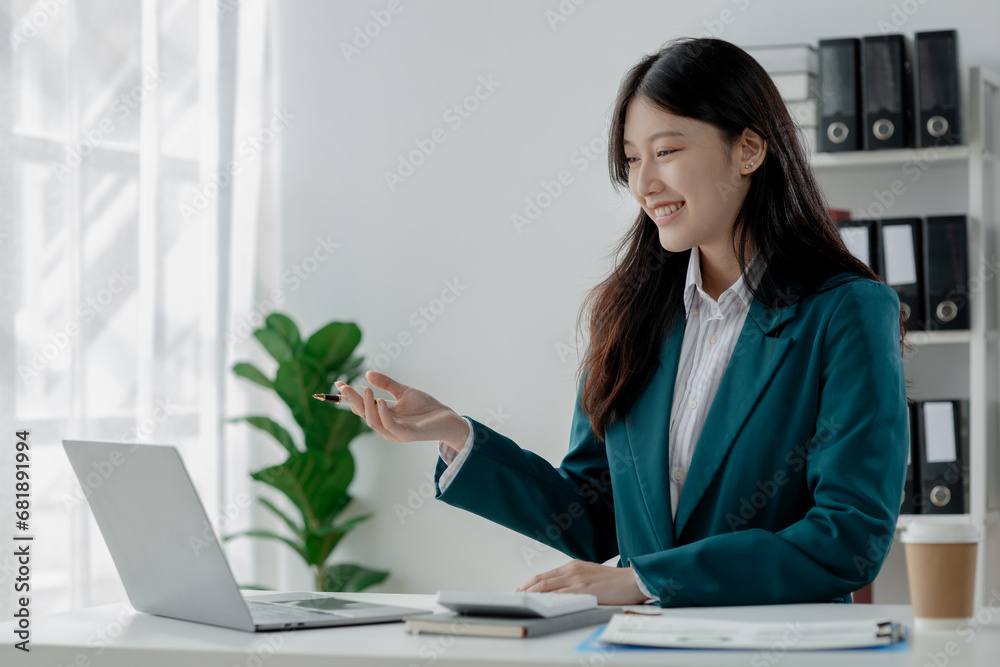 Businesswoman is sitting and working in the office, Employee is looking for information on laptop, Recording various information on paper, Businesswoman is sitting and working in the office, Employee is looking for information on laptop, Recording various information on paper,