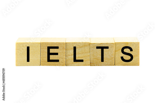 "IELTS" text or message short word english letter on a small wooden cubes block with white background.