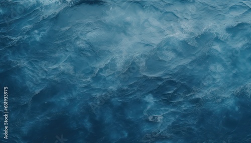 Deep blue ocean surface from underwater, ideal for marine themes, environmental campaigns, or tranquil backgrounds.