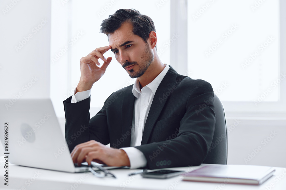 Man office tired businessman person sitting desk computer business working laptop Man office tired businessman person sitting desk computer business working laptop