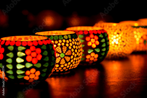 Diwali celebration Indian festival of lights Diya oil lamp lantern. Colors Rangoli decoration colorful flowers flowerbed copy space. Greetings Deepavali Hindu festival North India Mumbai Delhi India. photo