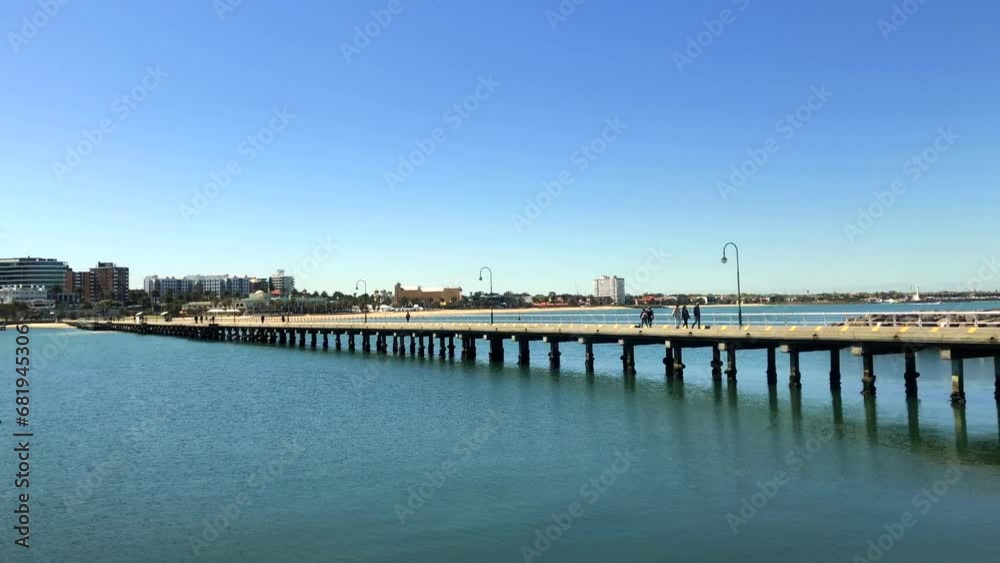Seaside town. Long pier. Seaside apartments. St Kilda pier, Melbourne, Australia. Seaside town. Long pier. Seaside apartments. St Kilda pier, Melbourne, Australia.