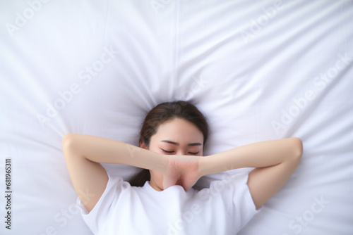 Asian woman resting on the bed