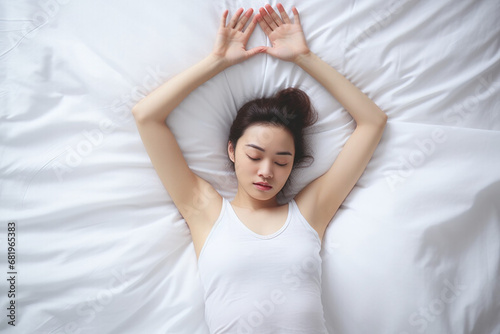 Asian woman resting on the bed