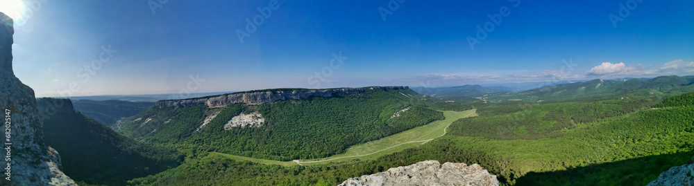 Mangup-Kale cave city, sunny day. Mountain view from the ancient cave town of Mangup-Kale in the Republic of Crimea, Russia. Bakhchisarai.