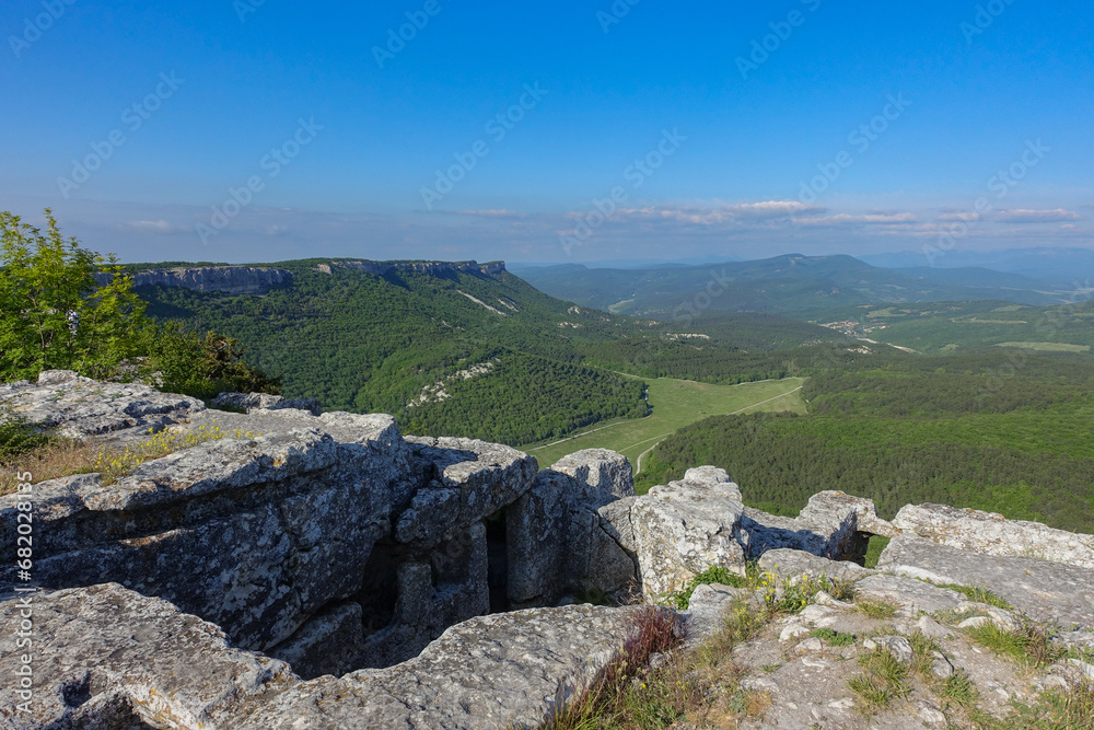 Mangup-Kale cave city, sunny day. Mountain view from the ancient cave town of Mangup-Kale in the Republic of Crimea, Russia. Bakhchisarai.