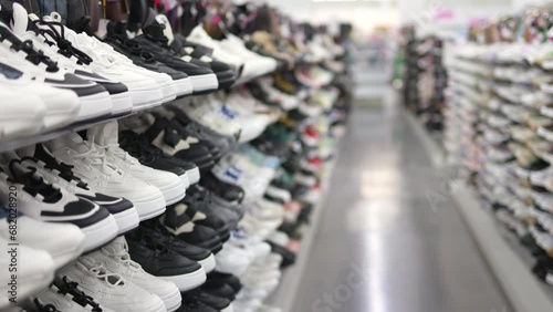 Shelves with sneakers in a store.