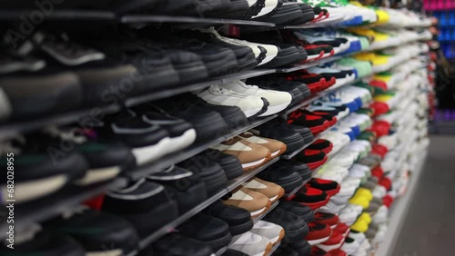 Shelves with sneakers in a store.