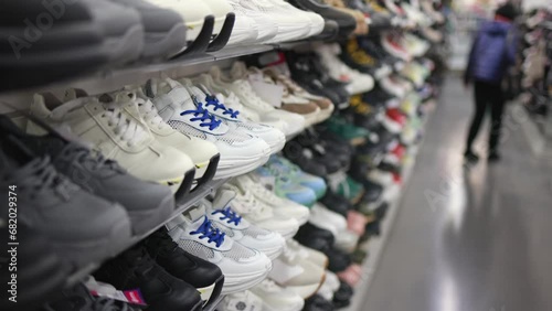Shelves with sneakers in a store.