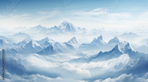  a view of the top of a mountain range from a bird's eye view of the clouds and the top of the mountain range in the foreground is a blue sky. © Anna