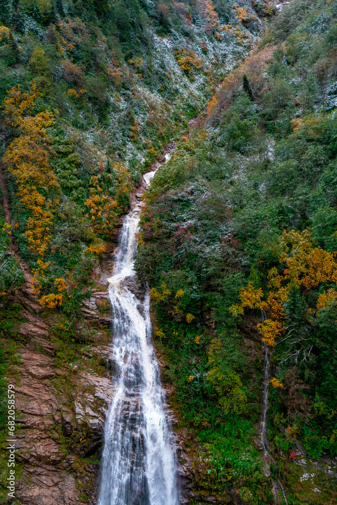 Ayder Plateau, Rize, Turkey. Waterfall in autumn. The water flowing naturally between the stones flows in the form of a waterfall. Scenic view of the waterfall in the forest.