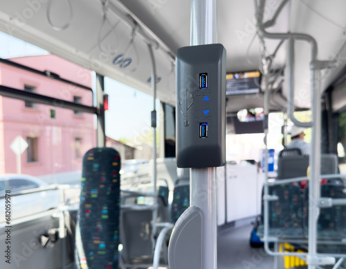 USB charging outlet or socket on a public transport bus in Europe. USB port slot charger in public bus for passenger photo