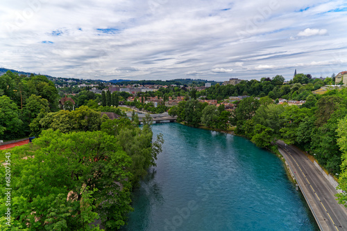 Scenic aerial view of Aare River with trees alongside urban road at Swiss City of Bern a cloudy summer day. Photo taken July 1st, 2023, Bern, Switzerland. © Michael Derrer Fuchs