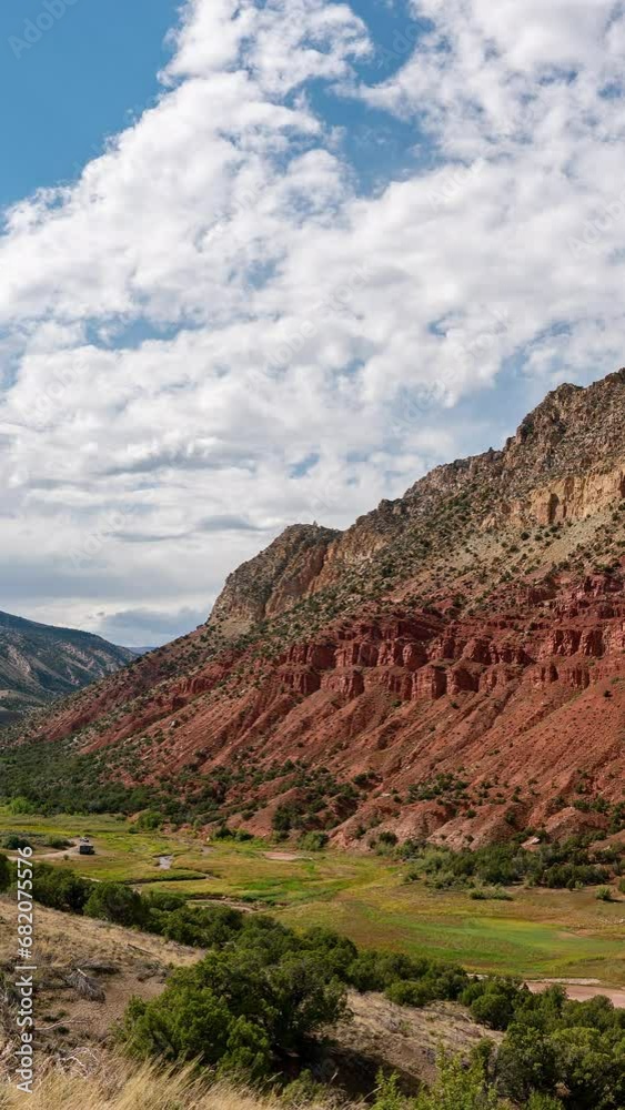 Vertical Timelapse overlooking Sheep Creek with colorful red cliffs at Flaming Gorge Utah. Vertical Timelapse overlooking Sheep Creek with colorful red cliffs at Flaming Gorge Utah.