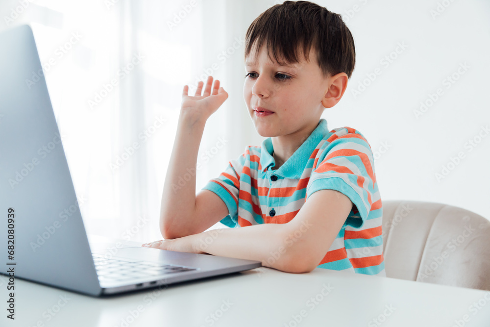 Boy doing homework at school on computer Boy doing homework at school on computer
