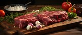 In the kitchen, a butcher skillfully prepares raw pork and beef ribs, marinating them in a garlic-infused mixture on a wooden board, ready for a delicious evening barbecue dinner. The succulent meat