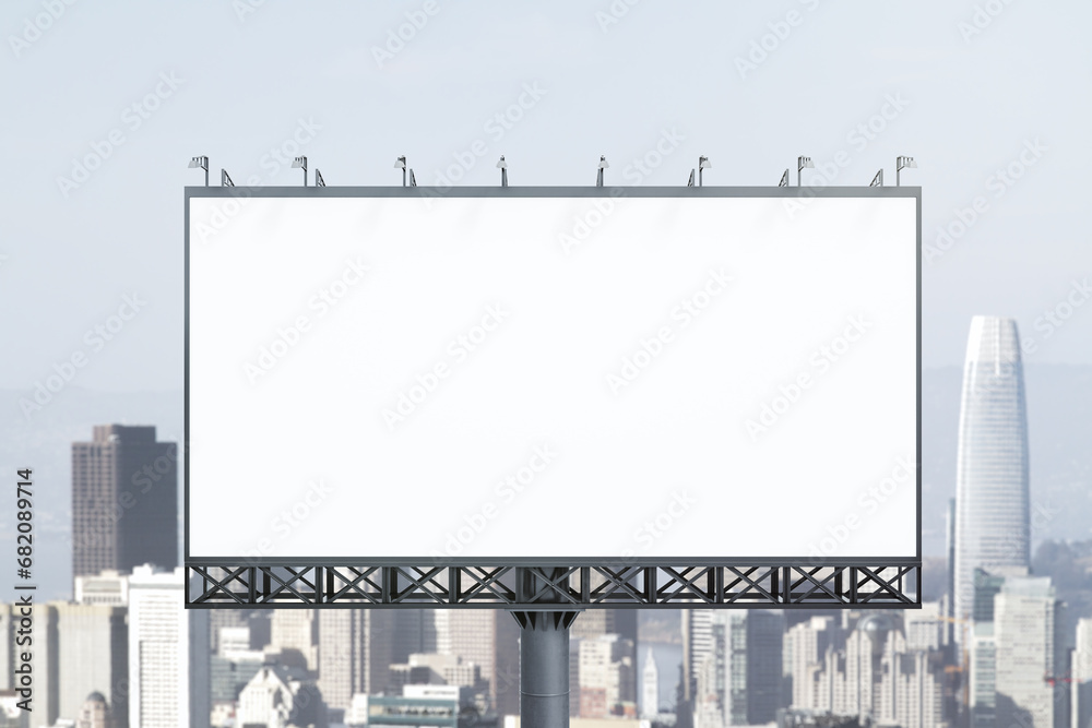 Obraz premium Blank white horizontal billboard on skyline background at daytime, front view. Mock up, advertising concept