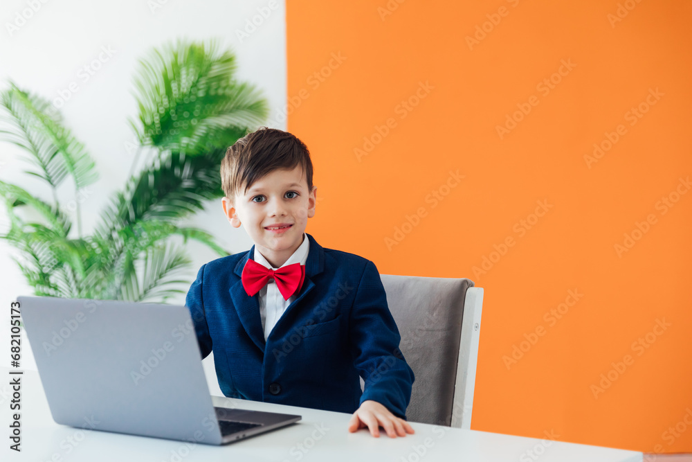 Little boy using laptop on white background Little boy using laptop on white background
