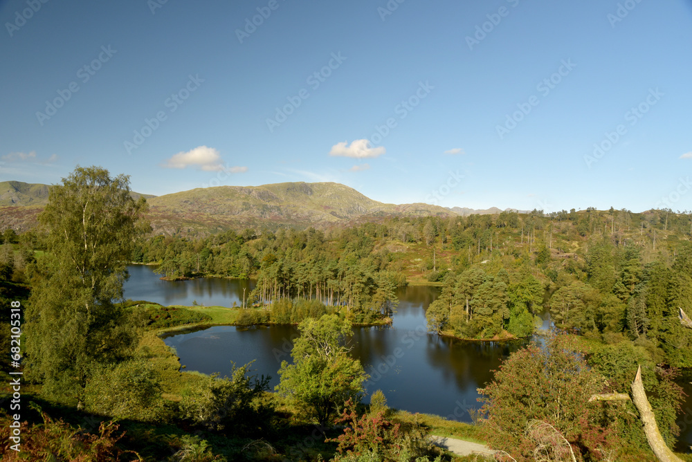 The peak of Wetherlam above the lakes at Tarn Hows in the Lake District