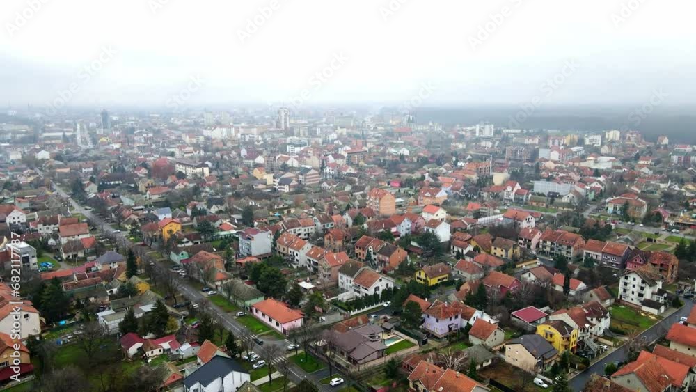 Drone flight above town of Pancevo, Serbia in foggy cloudy weather Drone flight above town of Pancevo, Serbia in foggy cloudy weather