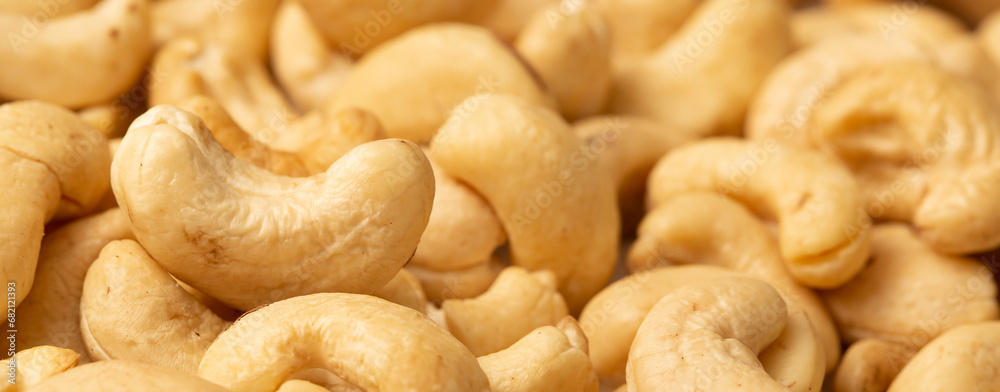 Cashew nuts as a background, top view. Cashew isolated on white background. Healthy foods. Cashew nuts as a background, top view. Cashew isolated on white background. Healthy foods.