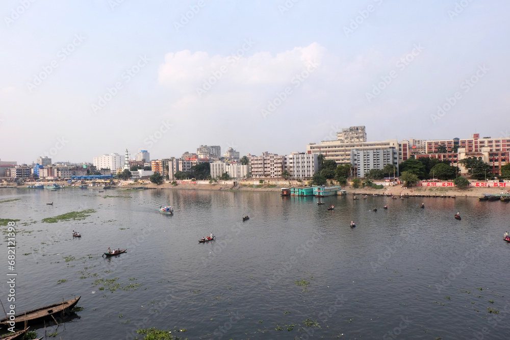 People on both sides of the Buriganga river in Dhaka cross the river by traditional boat in this country because of the mother river.