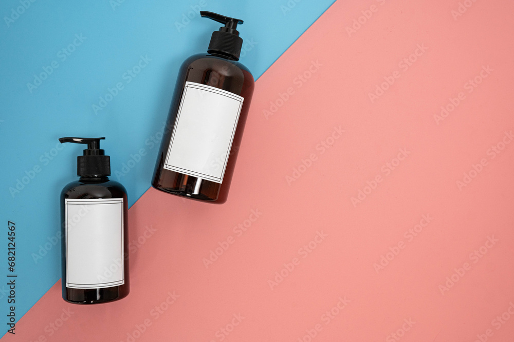 Body care. set of bottles with dispensers on a blue and pink background. Advertising concept Body care. set of bottles with dispensers on a blue and pink background. Advertising concept