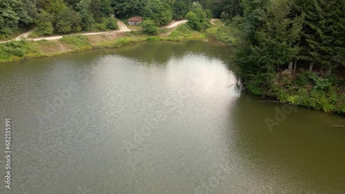 High angle view of a lake Radalj in Serbia and the woods behind it photo