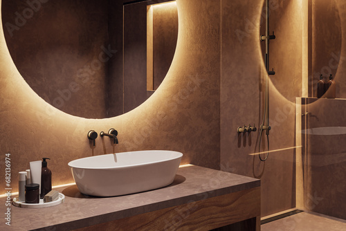 Clean bathroom interior with illuminated round mirror and sink. 3D Rendering.