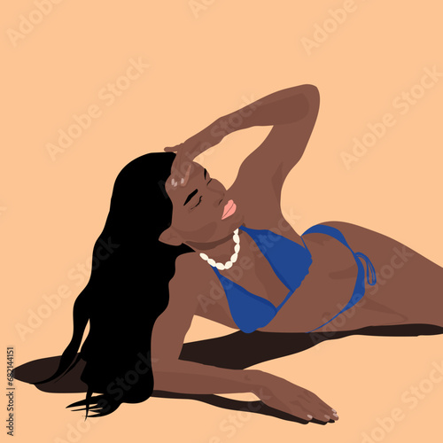 A brown girl sunbathing on the beach