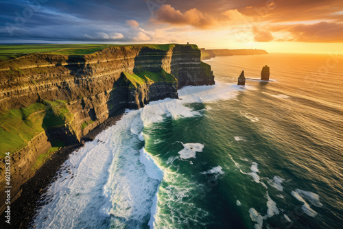 Aerial view of the Cliffs of Moher in Ireland, beautiful blue ocean and green grassy fields