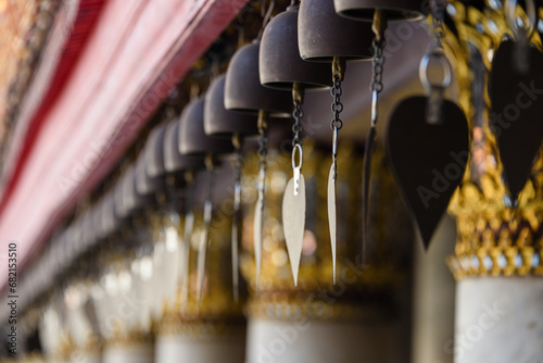 Cast iron bells wind chimes outside Wat Benchamabophit (The Marble Temple), Bangkok, Thailand photo