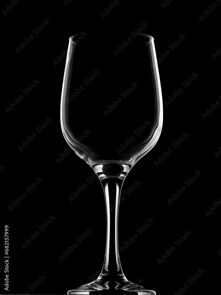 Wine glass outline on black background. Studio photo. Wine glass outline on black background. Studio photo.