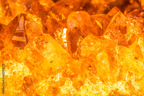 Golden crystal mineral stone. Gems. Mineral crystals in the natural environment. Texture of precious and semiprecious stones. Seamless background with copy space. photo