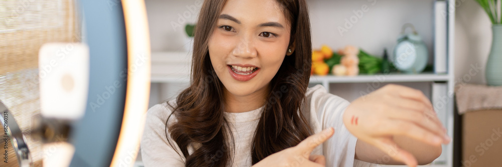Beautiful women with social media influences are teaching makeup and use cosmetics, In front of the camera to recording vlog video live streaming, Online business on concept of beauty bloggers. Beautiful women with social media influences are teaching makeup and use cosmetics, In front of the camera to recording vlog video live streaming, Online business on concept of beauty bloggers.