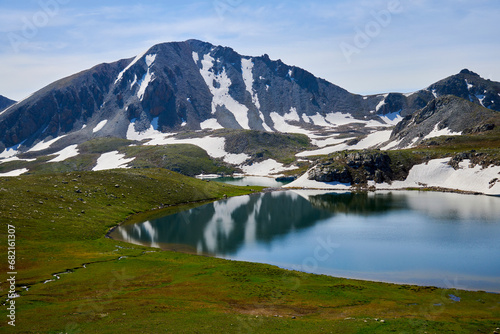 Beautiful blue mountain lakes at high altitude. Beautiful mountain landscapes. Valley of lakes in the Kensu gorge in Kazakhstan. Almaty region. 