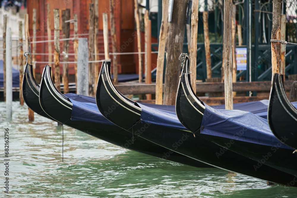 Gondola boats in close up. Traditional Venetian gondolas in Grand Canal. Venice - 5 May, 2019