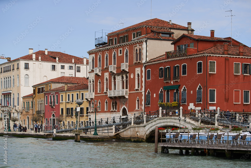 Italian palazzo on the waterfront of Grand Canal. Traditional Venetian buildings by the channel. Venice - 6 May, 2019