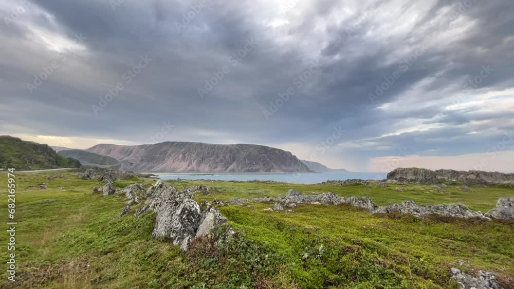 Cloudy evening sky over the rocky shoreline of the Barents Sea, Northern Norway Cloudy evening sky over the rocky shoreline of the Barents Sea, Northern Norway